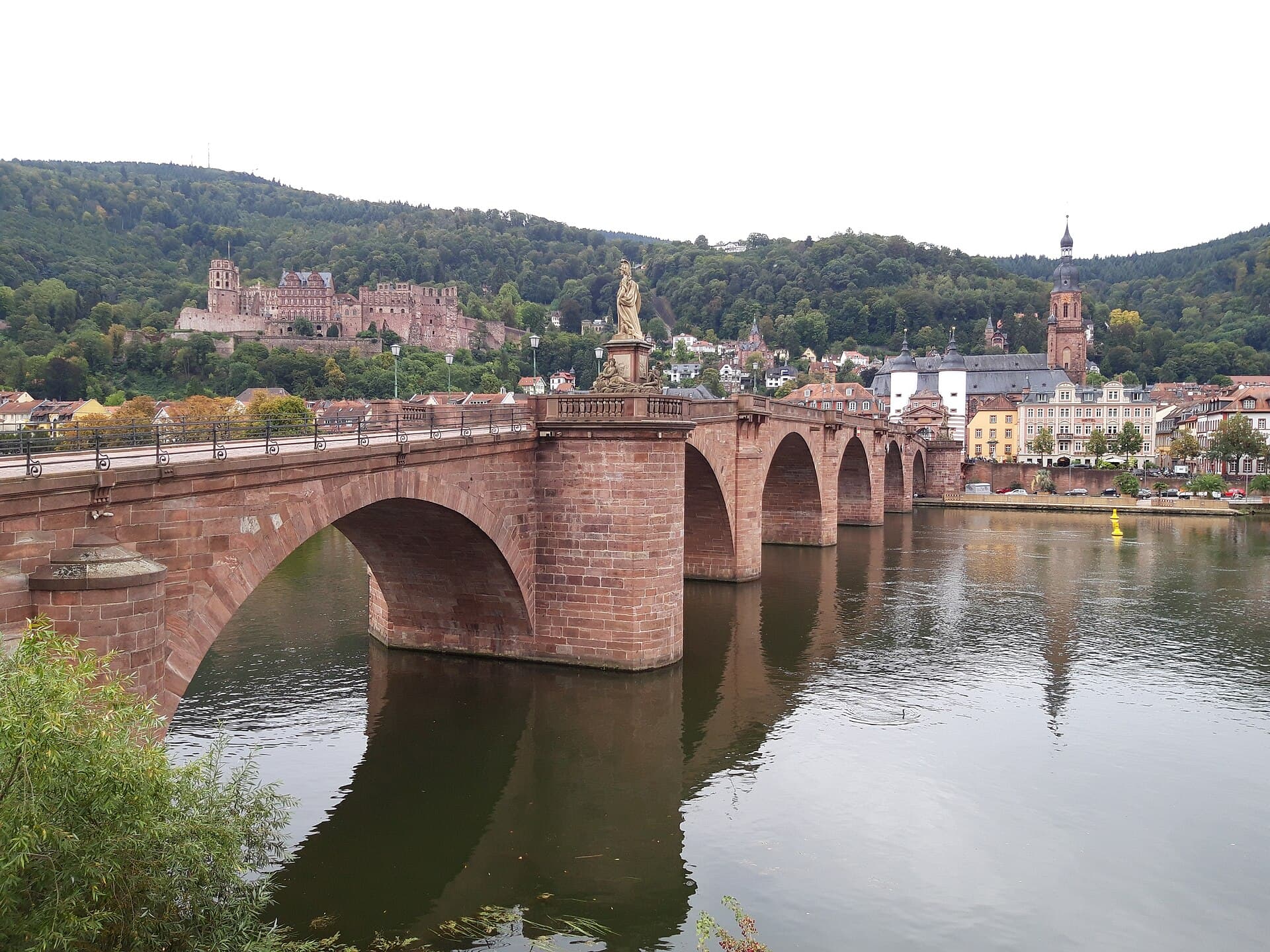 View from a holiday apartment over the rooftops of an old town by a river